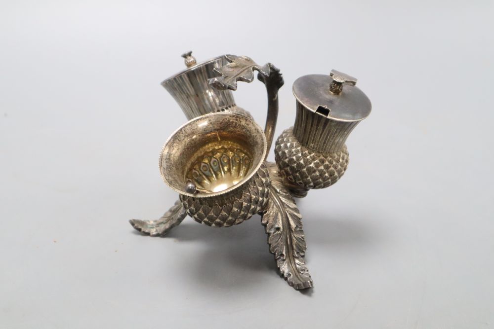 A Victorian electroplate thistle three piece cruet set, height 10cm